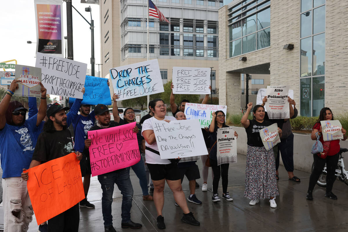 People rally outside the U.S. Immigration and Customs Enforcement offices in downtown Las Vegas ...