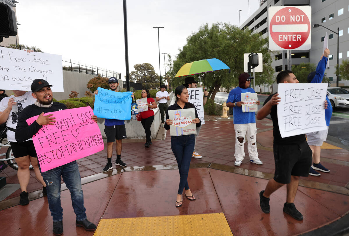 People rally outside the U.S. Immigration and Customs Enforcement offices in downtown Las Vegas ...