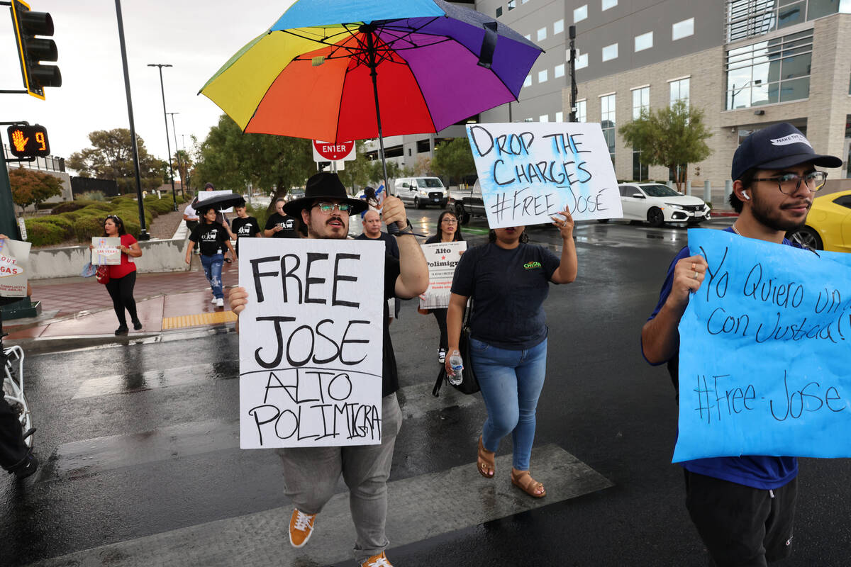 People rally outside the U.S. Immigration and Customs Enforcement offices in downtown Las Vegas ...