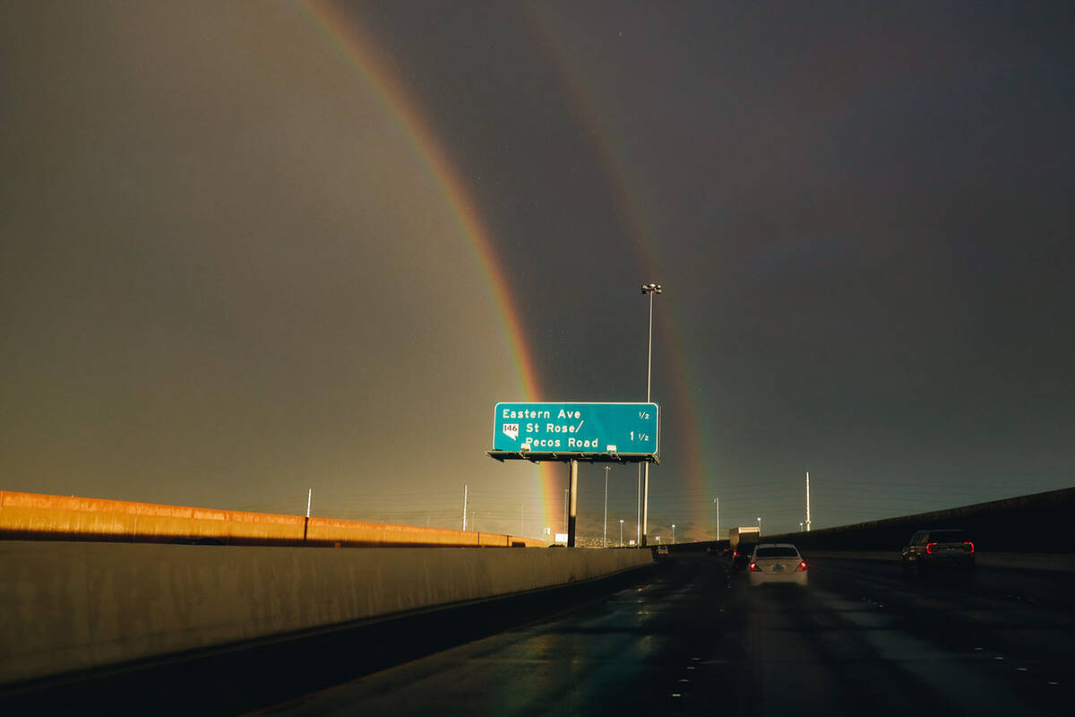 A double rainbow is seen on Nevada Route 146 during rainfall on Friday, Aug. 18, 2023, in Las V ...