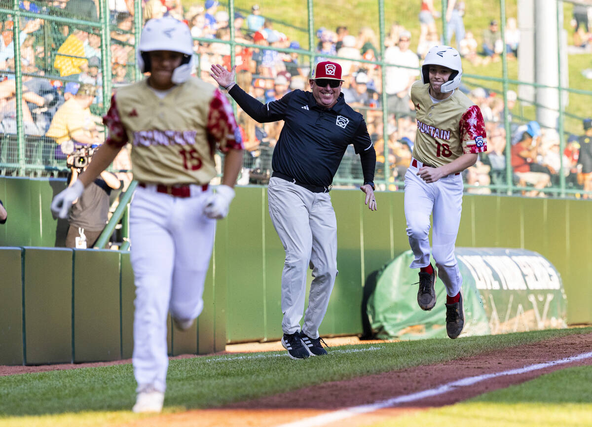 The Henderson All-Stars shortstop Nolan Gifford (18) celebrates with teammate David Edwards (15 ...