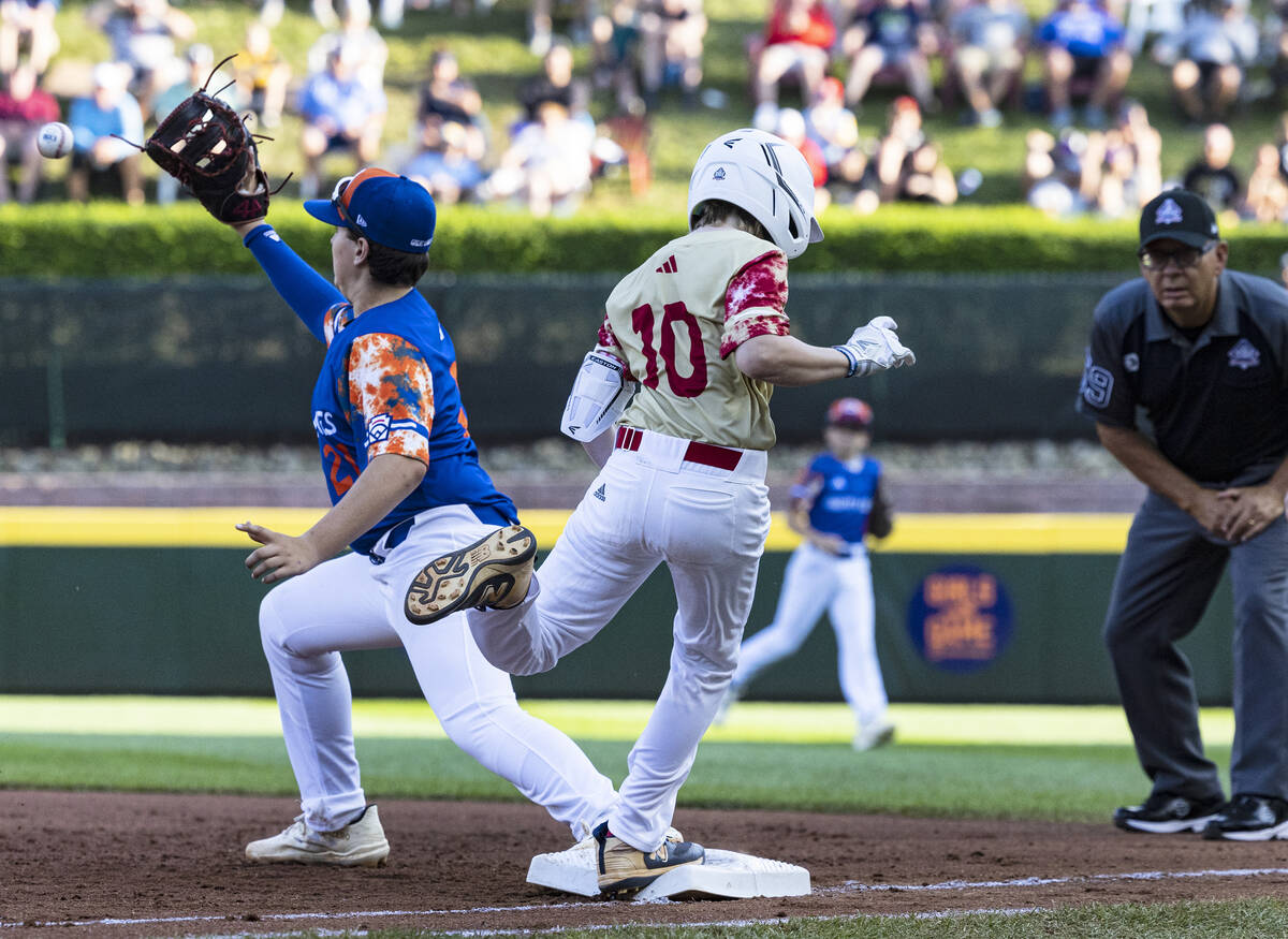 The Henderson All-Stars Truman Morris (10) beats a throw at first as New Albany, Ohio, first ba ...