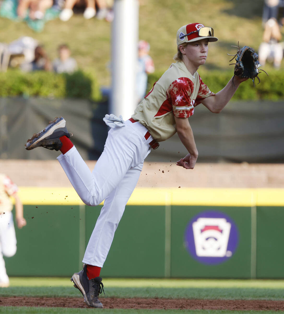 The Henderson All-Stars shortstop Henry Bush throws for an out to first against New Albany, Ohi ...