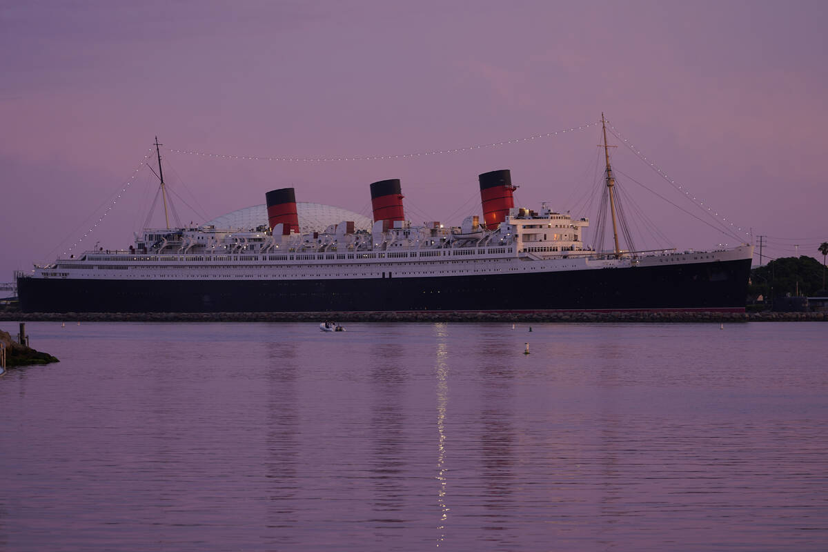 The RMS Queen Mary ship is seen at dusk ahead of Hurricane Hilary's expected landfall in Long B ...