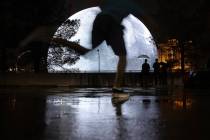 Despite rain, people visit the Sphere on Saturday, Aug. 19, 2023, in Las Vegas. Southern Nevada ...