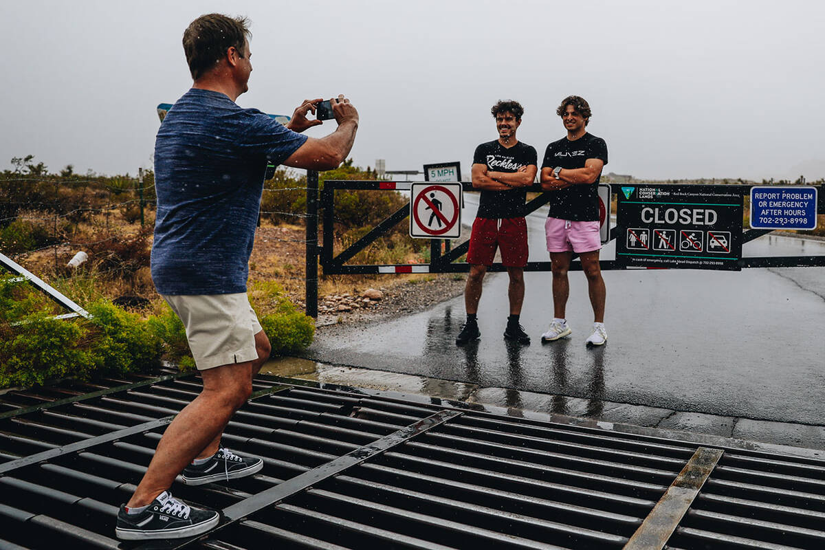 Scott Kluck, left, takes a photograph of Devin Llanas, 19, middle, and Logan Kluck, 19, in fron ...