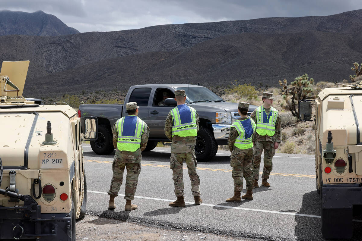 Nevada State Police, Las Vegas police and Nevada National Guard military police close the road ...