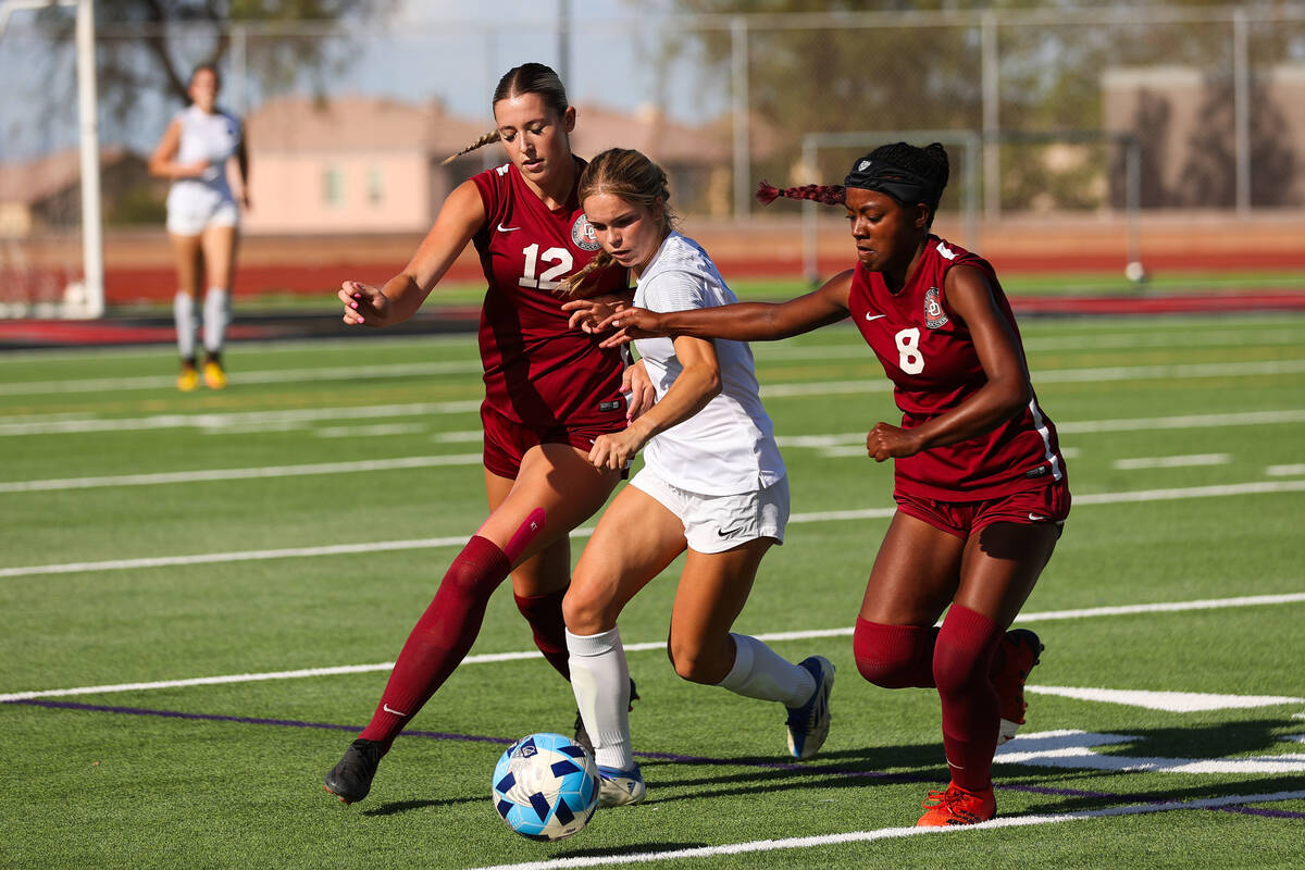 Foothill’s Savanna Truax (3) moves the ball past Desert Oasis’ Lillian Felise (8) and Taylo ...