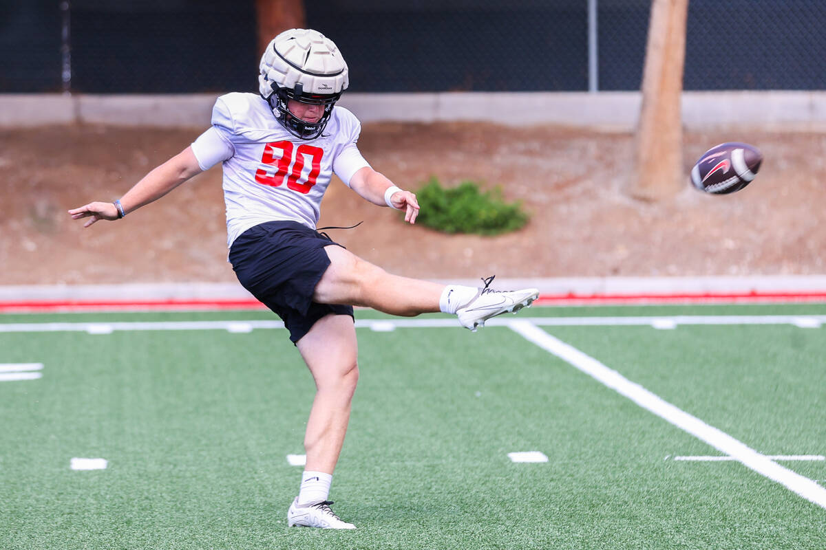 UNLV punter Marshall Nichols (90) kicks the ball during a UNLV football practice on Monday, Aug ...