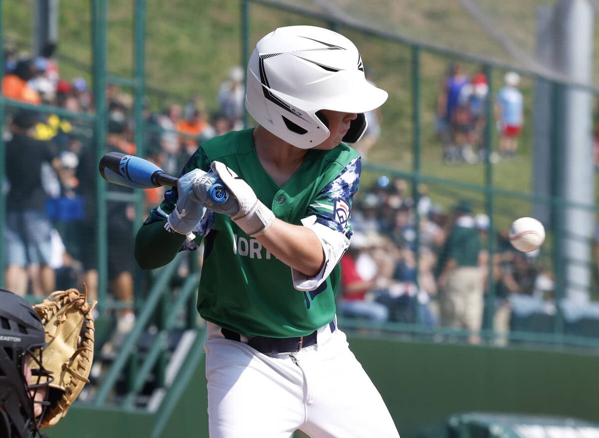 Seattle, Washington's Calvin Shumway is hit by a pitch during the Little League World Series to ...