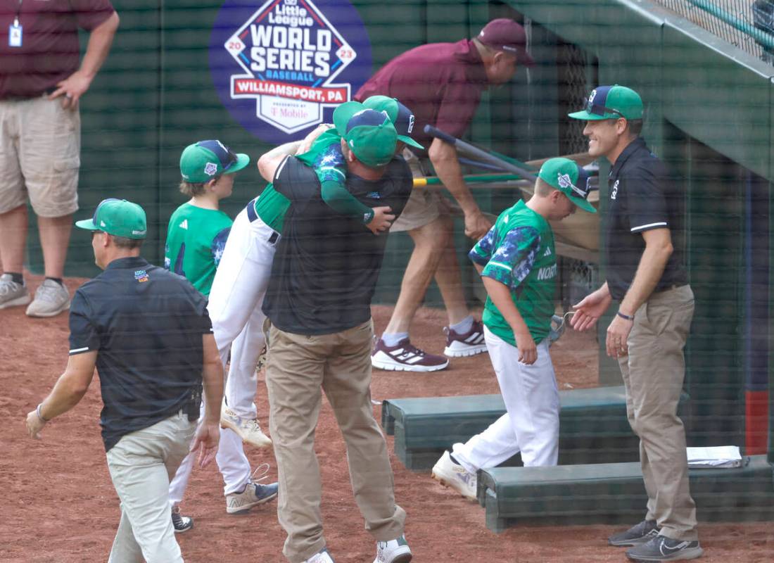 Seattle, Washington, players and coaches celebrate their win against Nolensville, Tennessee, du ...