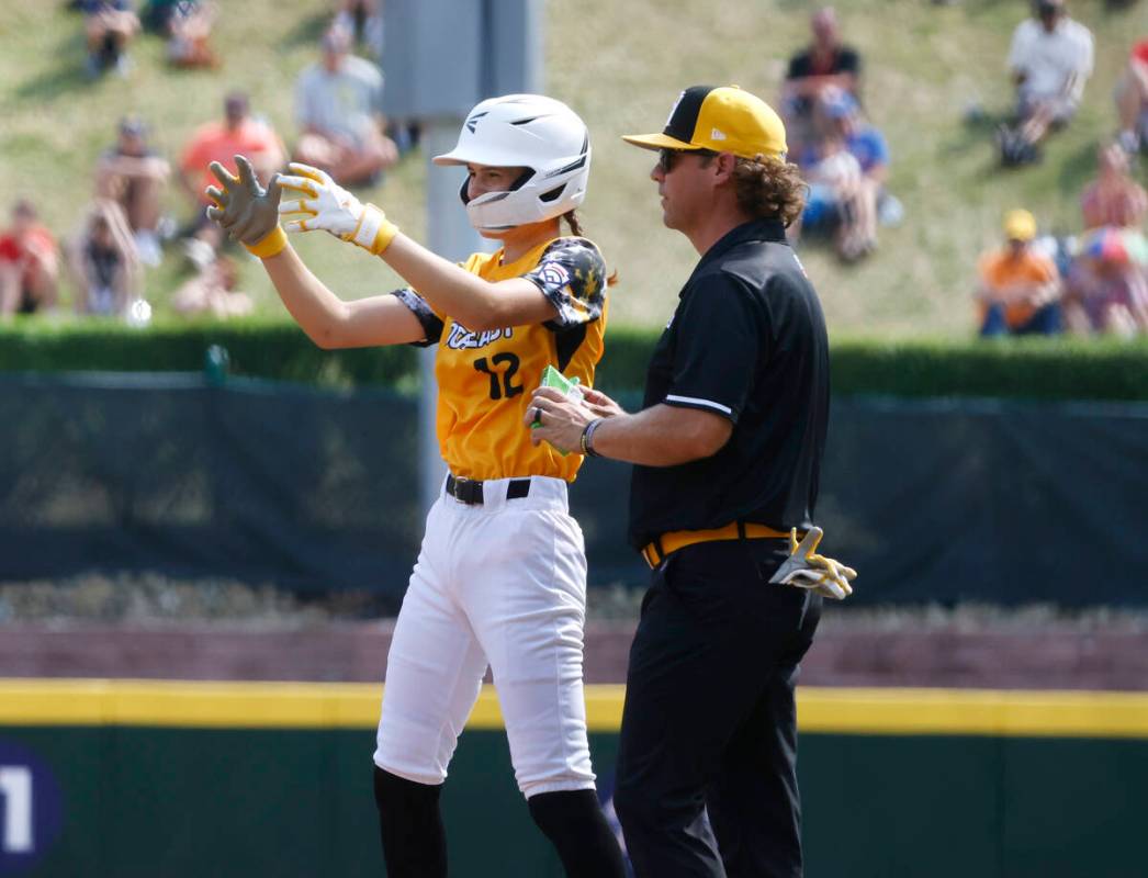 Nolensville, Tennessee pitcher Stella Weaver reacts after hitting a double against Seattle, Was ...