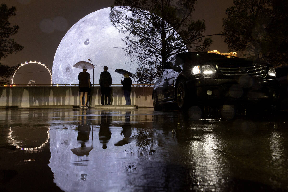 Despite rain, people visit the Sphere on Saturday, Aug. 19, 2023, in Las Vegas. (Ellen Schmidt/ ...