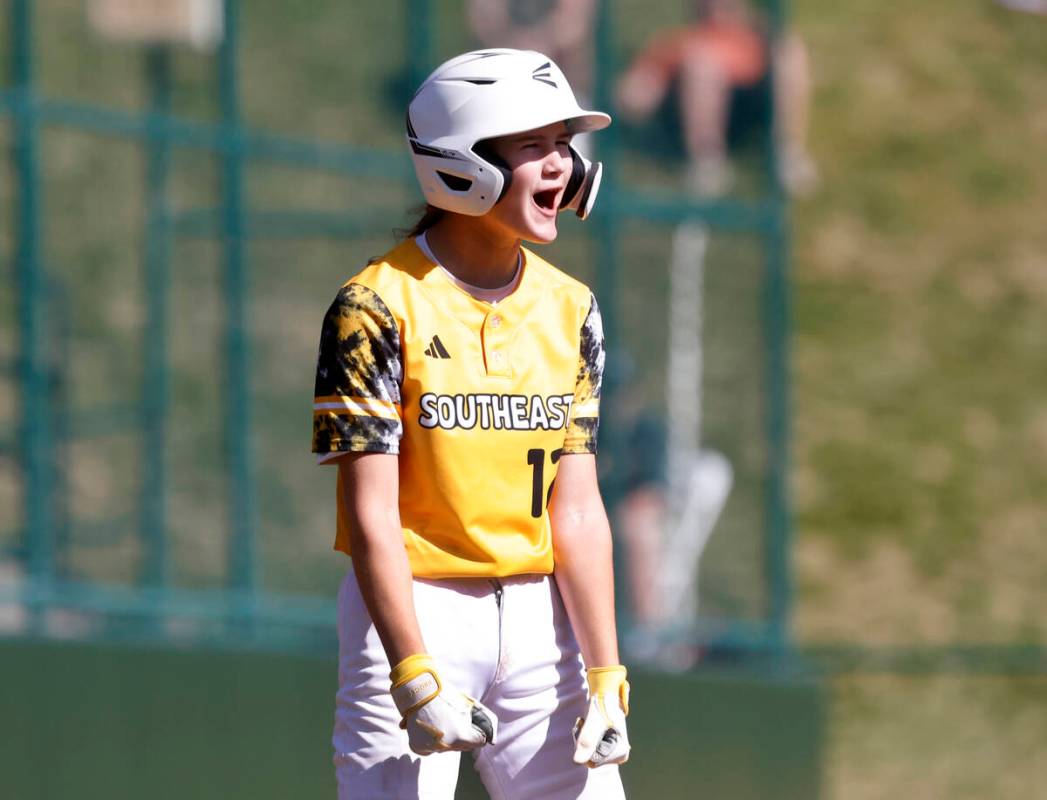 Nolensville, Tennessee, designated hitter Stella Weaver reacts after stealing third base during ...