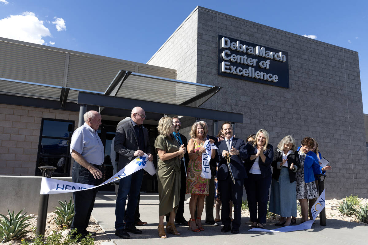 Local officials including Henderson Mayor Michelle Romero, center left, former Henderson Mayor ...