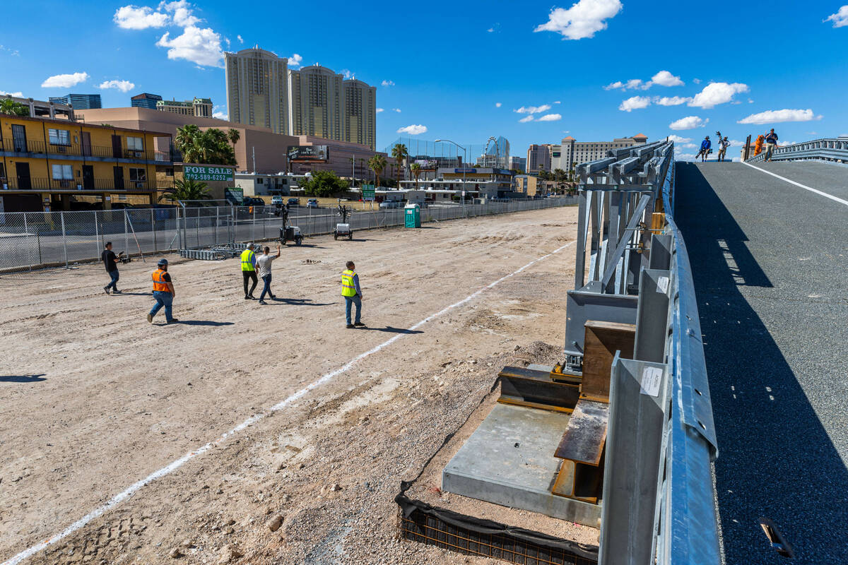 Members of the media walk across and beside a span as the Las Vegas Grand Prix, Inc. gives a pr ...