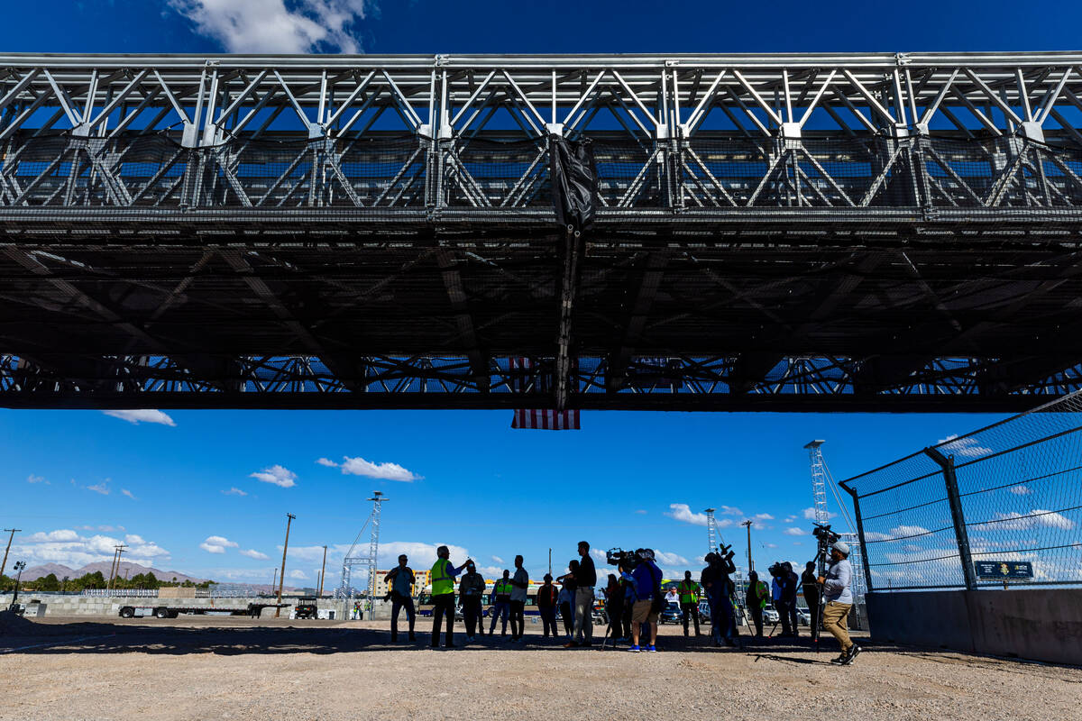 Members of the media gather beneath a span as the Las Vegas Grand Prix, Inc. gives a preview of ...