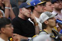 Oakland Athletics owner John Fisher, middle, watches during Game 2 of basketball's NBA Finals b ...