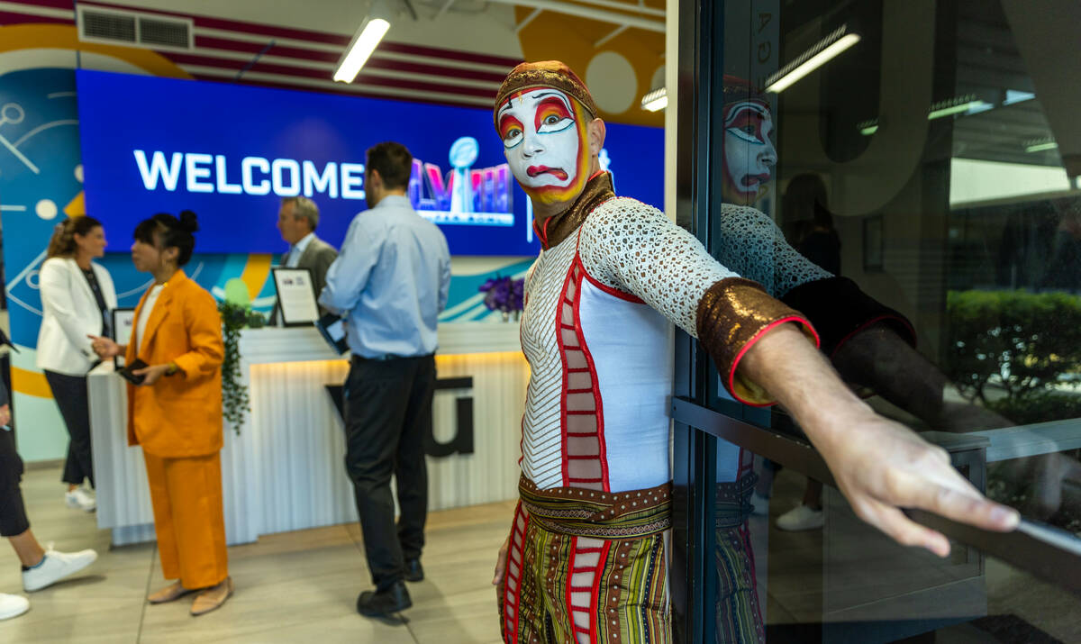 A Cirque du Soleil performer welcomes guests as the National Football League and the Las Vegas ...