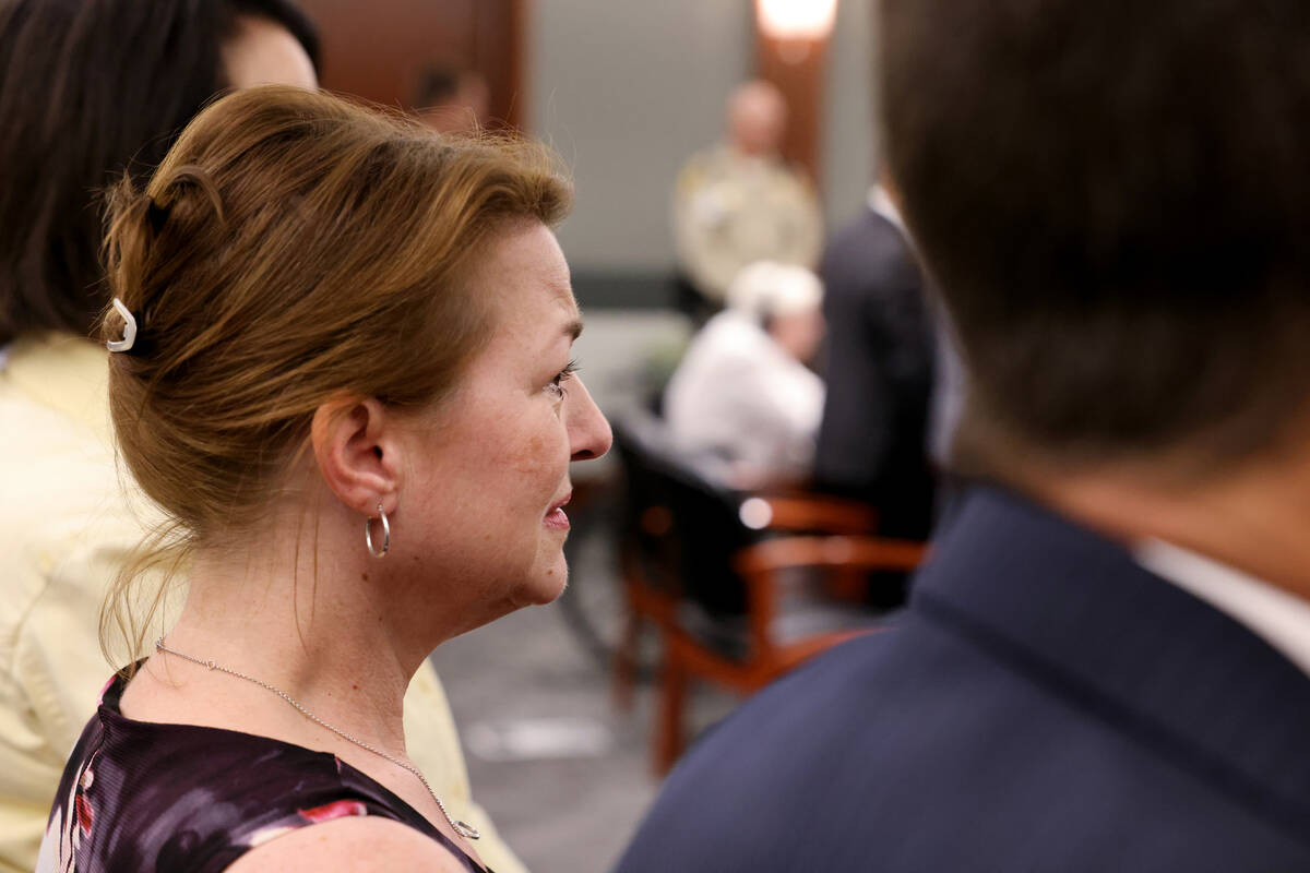 Colleen Beyer, daughter of murder victim Sharon Causse Randolph, stands as the jury leave the c ...