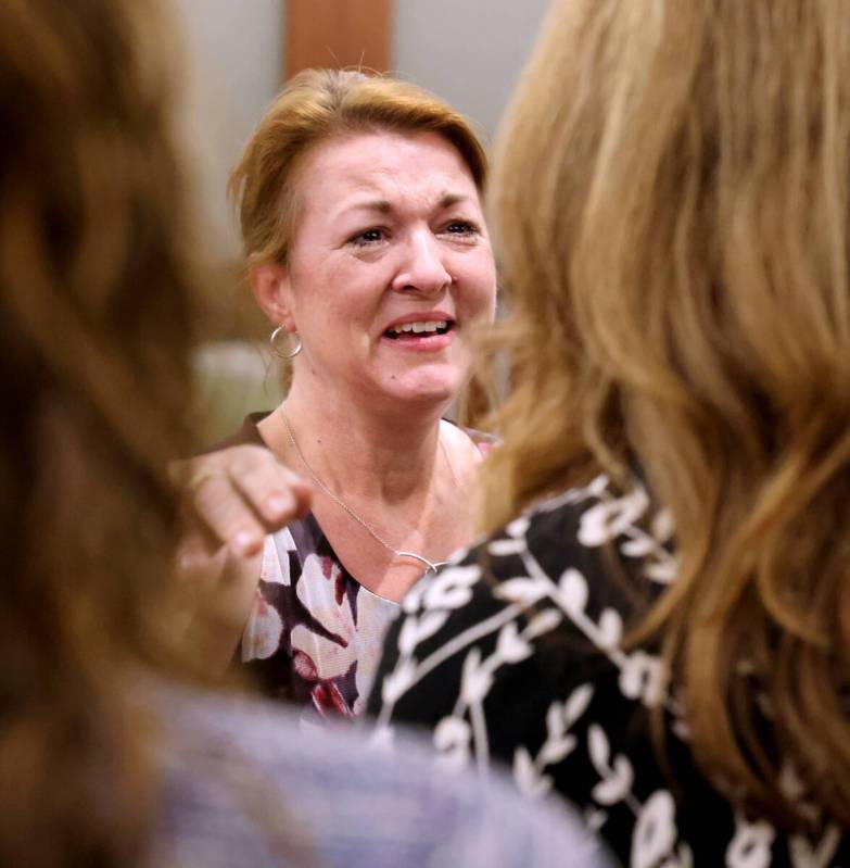 Colleen Beyer, daughter of murder victim Sharon Causse Randolph, hugs Prosecutor Pam Weckerly i ...