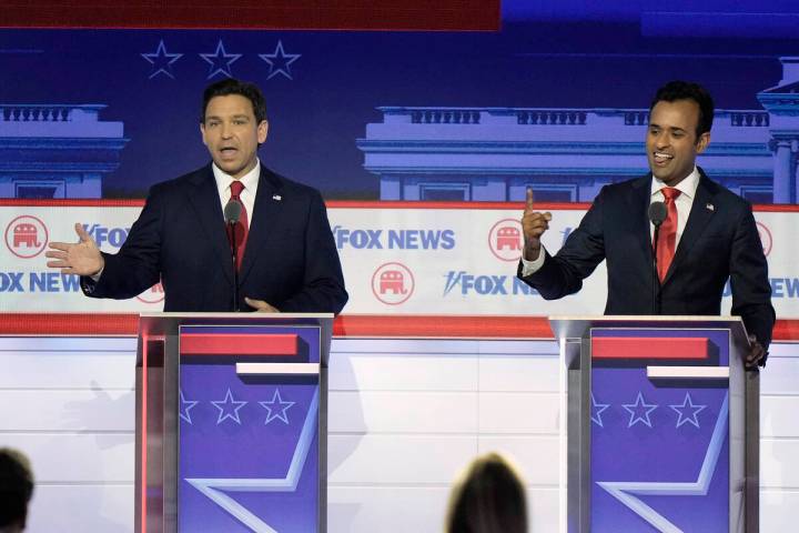 Florida Gov. Ron DeSantis and businessman Vivek Ramaswamy speak at the same time during a Repub ...