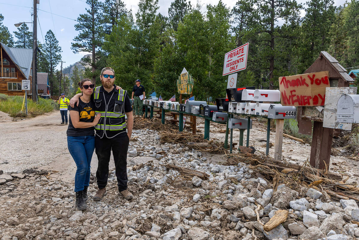 Old Town residents Katie and Sean Reeh listen to a press conference with area agency coordinato ...