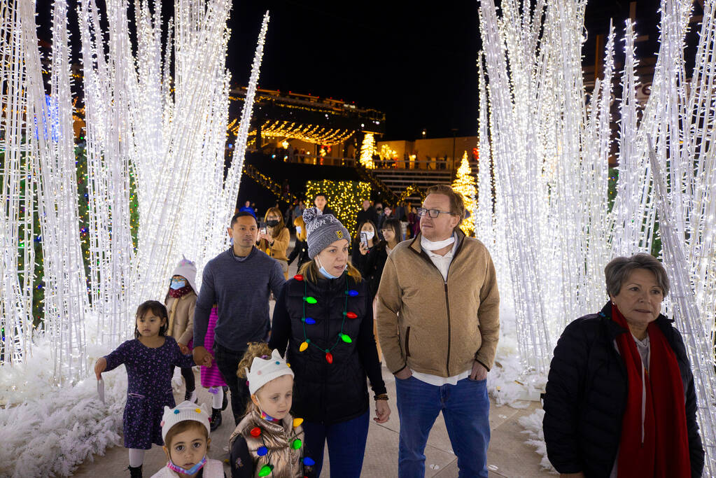 Attendees explore Enchant Christmas at Las Vegas Ballpark on Tuesday, Nov. 30, 2021, in Las Veg ...