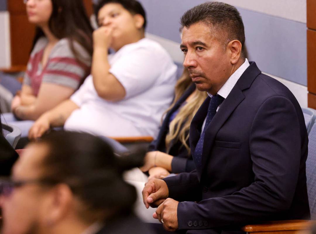 Former Alpine Motel Apartments owner Adolfo Orozco-Garcia, right, waits to appear in Clark Coun ...