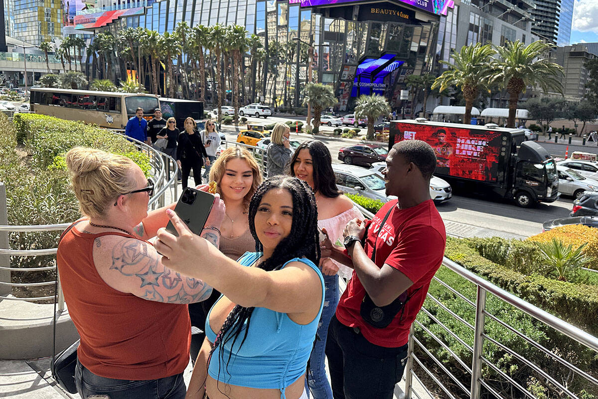 Nya Hudson, 21, of Washington takes a selfie on the Strip at Planet Hollywood Resort in Las Veg ...