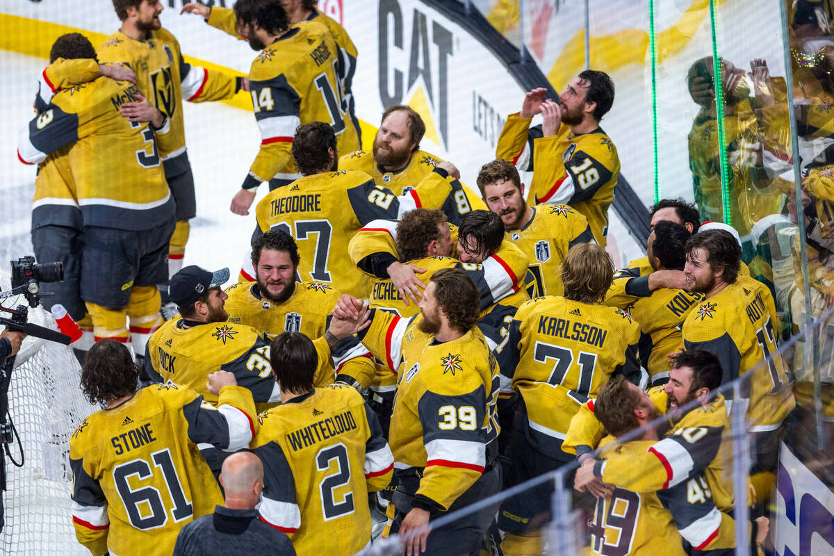 Golden Knights players come together in celebration after defeating the Florida Panthers 9-3 in ...