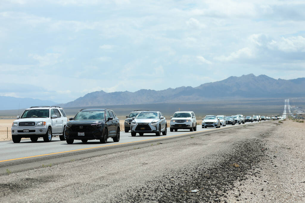 Cars traveling from California sit in traffic on Interstate 15 after passing over the state bor ...