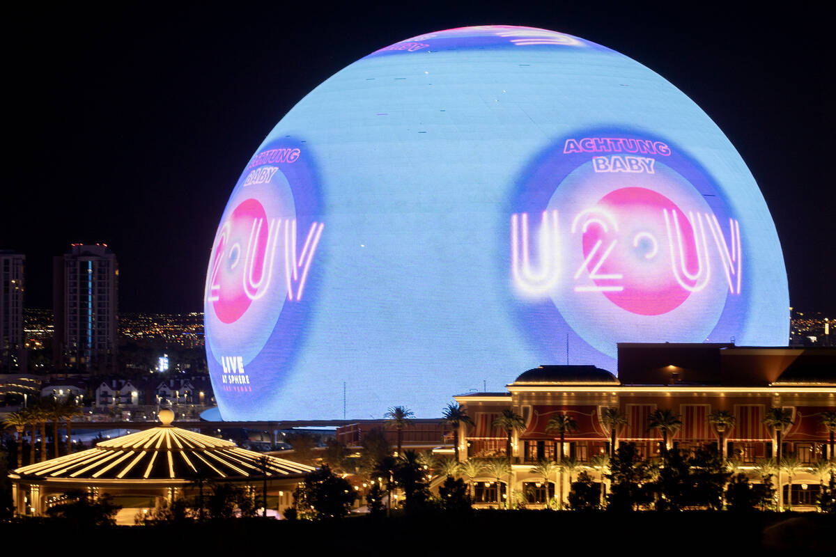 The Sphere shows an advertisement for its opening show, U2, as seen from the Encore parking gar ...