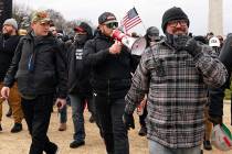 FILE - Proud Boys members including Zachary Rehl, left, Ethan Nordean, center, and Joseph Biggs ...