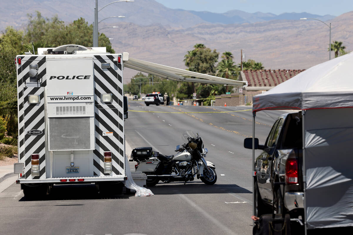 Las Vegas police investigate the scene of a fatal crash on North Tenaya Way near West Centennia ...