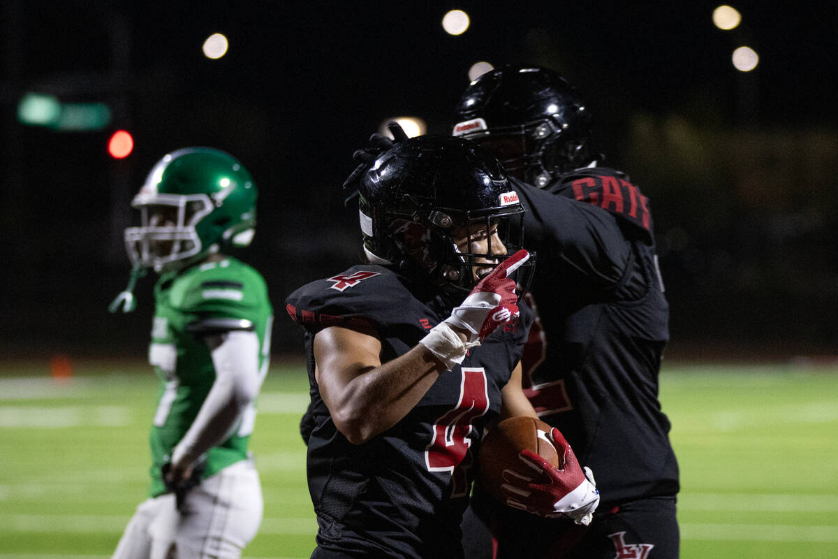 Las Vegas' Julian Torres (4) celebrates his touchdown over Rancho during the second half of a h ...