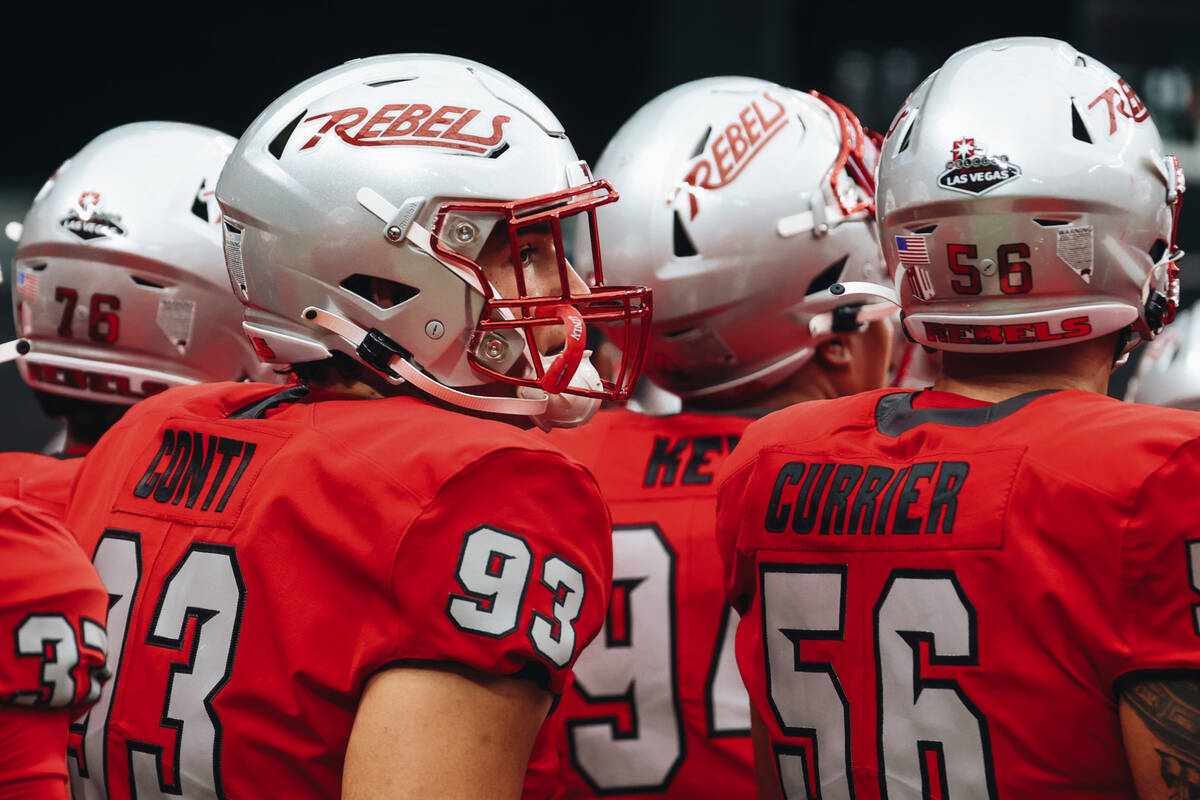 UNLV players listen to coaches speak before a game against Bryant at Allegiant Stadium on Satur ...