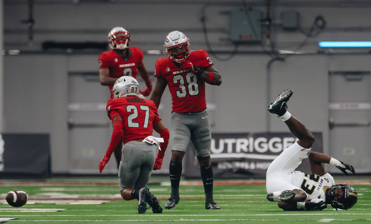 Bryant running back Simi Bakare (23) takes a tumble after losing the ball from a tackle by UNLV ...