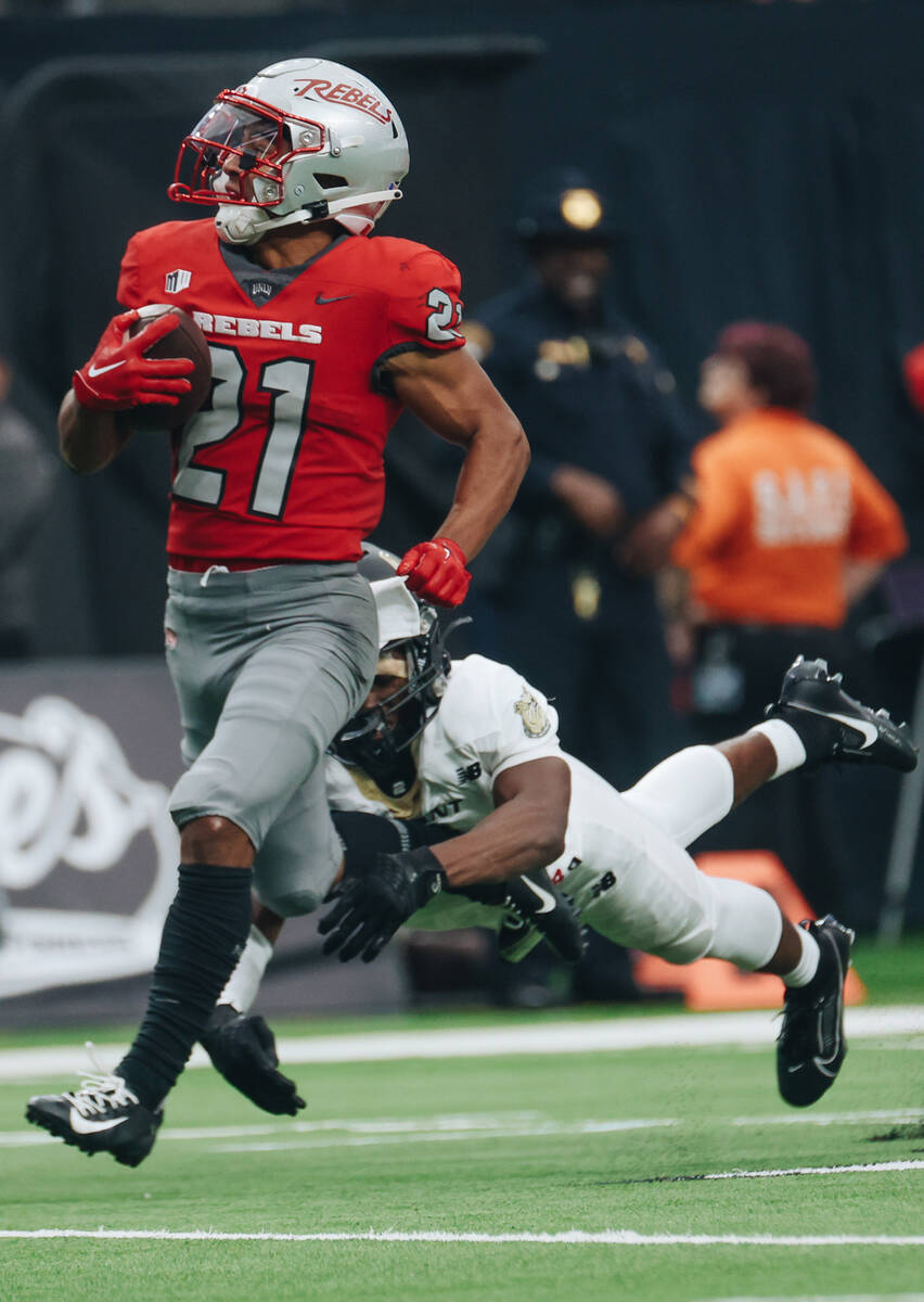 UNLV wide receiver Jacob De Jesus (21) runs the ball down the field during a game against Bryan ...