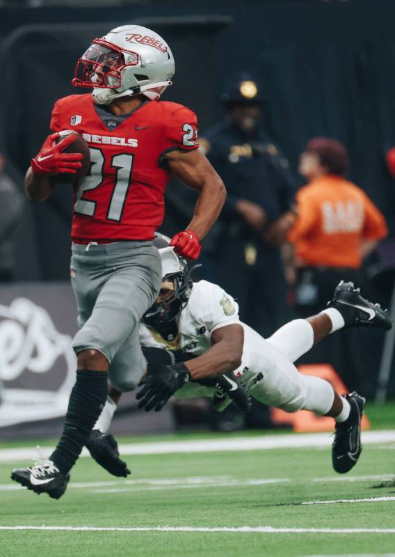 UNLV wide receiver Jacob De Jesus (21) runs the ball down the field during a game against Bryan ...