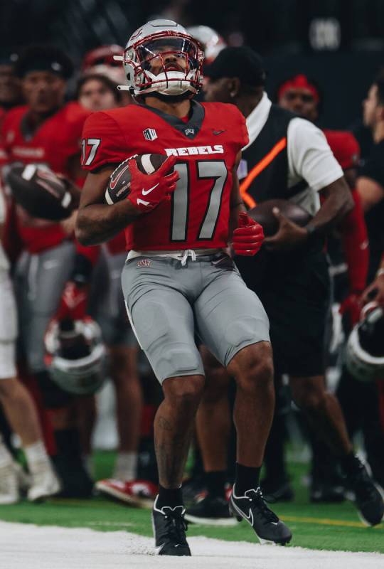 UNLV wide receiver Dominic Gicinto runs the ball to the sidelines during a play in a game again ...