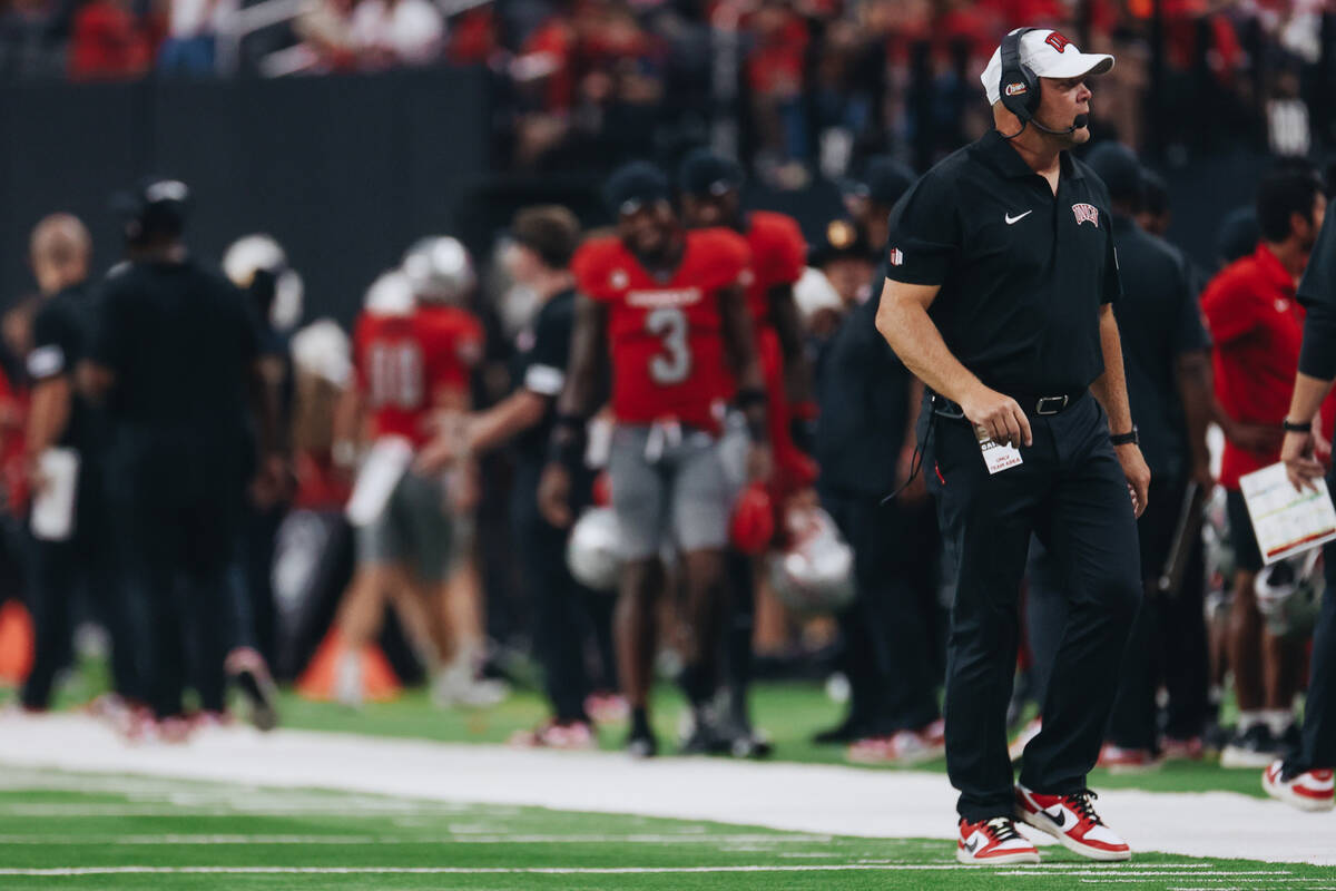 UNLV head football coach Barry Odom walks the field during a time out in a game against Bryant ...