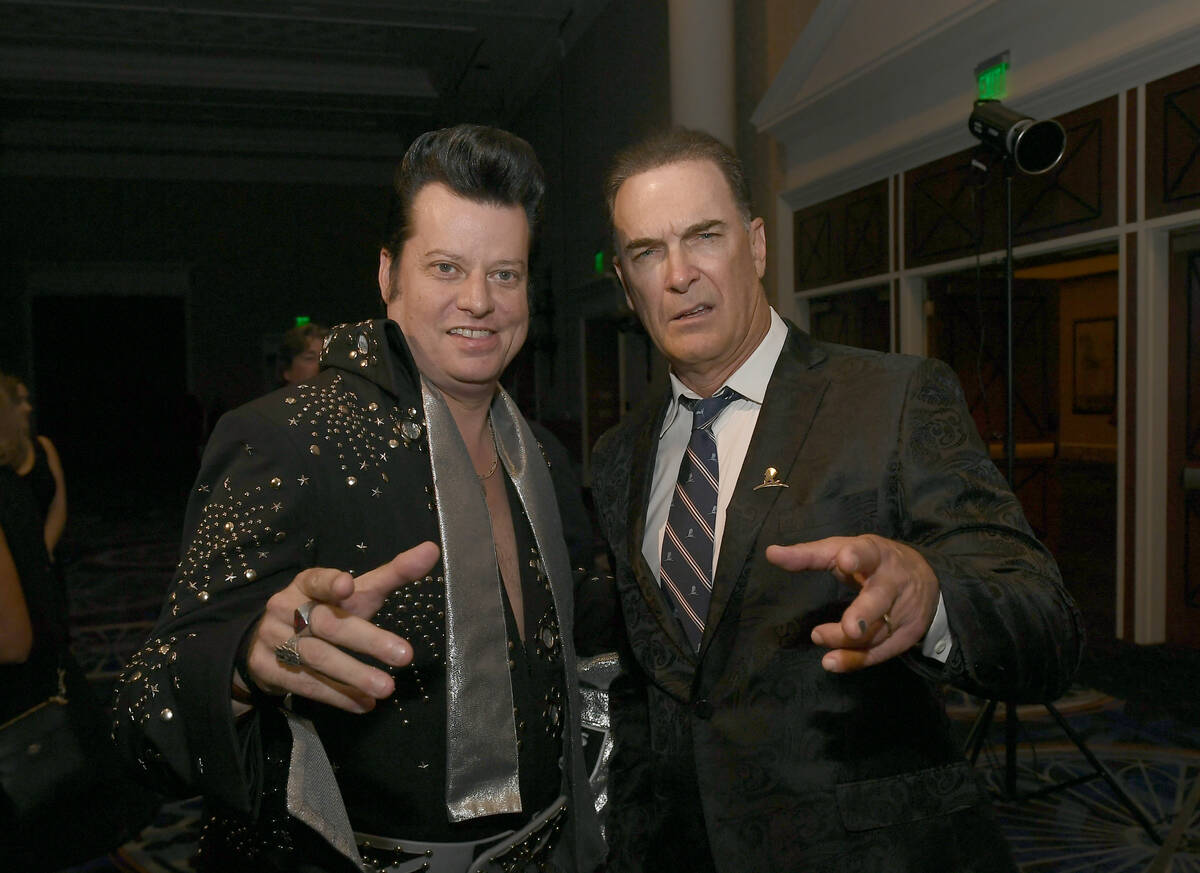 Elvis impersonator Brian Mills and actor Patrick Warburton attend a wedding vow renewal ceremon ...