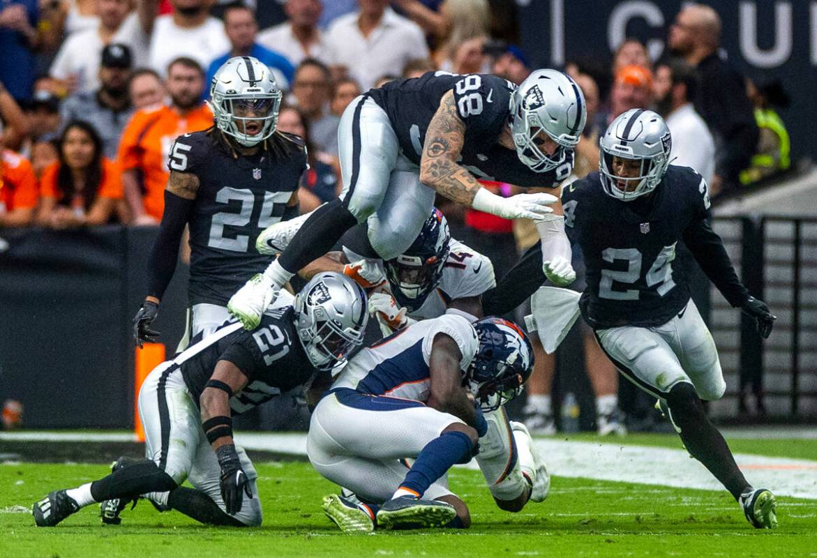 Denver Broncos wide receiver Jerry Jeudy (10) is taken down by Raiders cornerback Amik Robertso ...