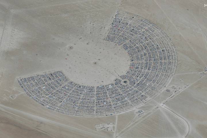 In this satellite photo provided by Maxar Technologies, an overview of Burning Man festival in ...