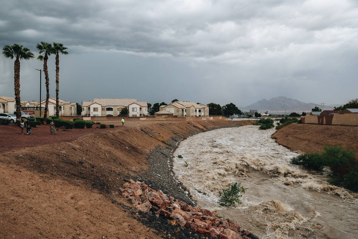 Duck Creek floods from recent rainfall near Jack in the Box at East Russell Road on Friday, Sep ...