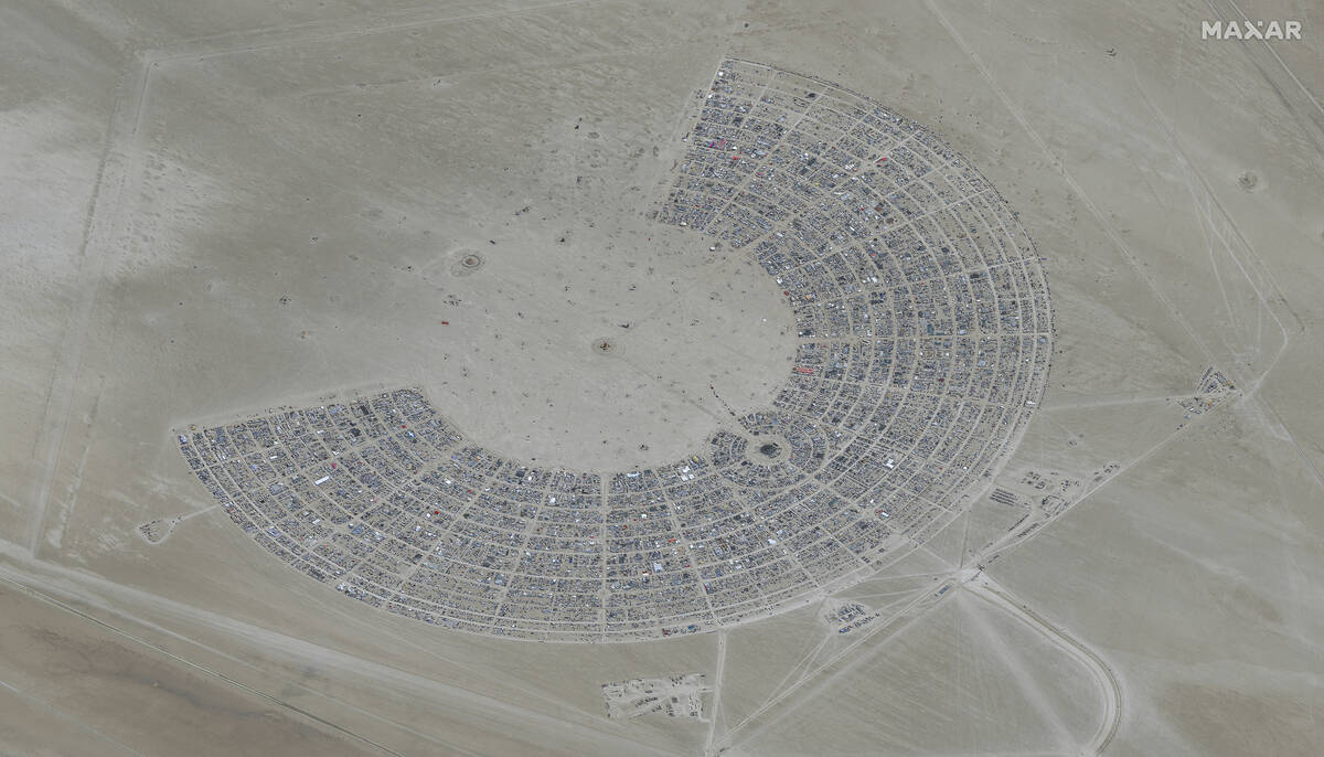 In this satellite photo provided by Maxar Technologies, an overview of Burning Man festival in ...