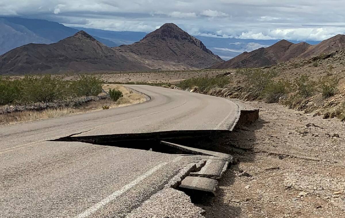 A collapsed section of pavement on Daylight Pass Road is shown in this undated photo from Death ...