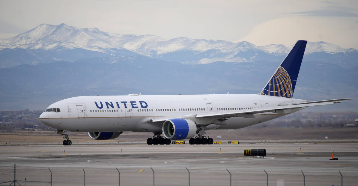 A United Airlines jetliner taxis to a runway for take off from Denver International Airport, De ...