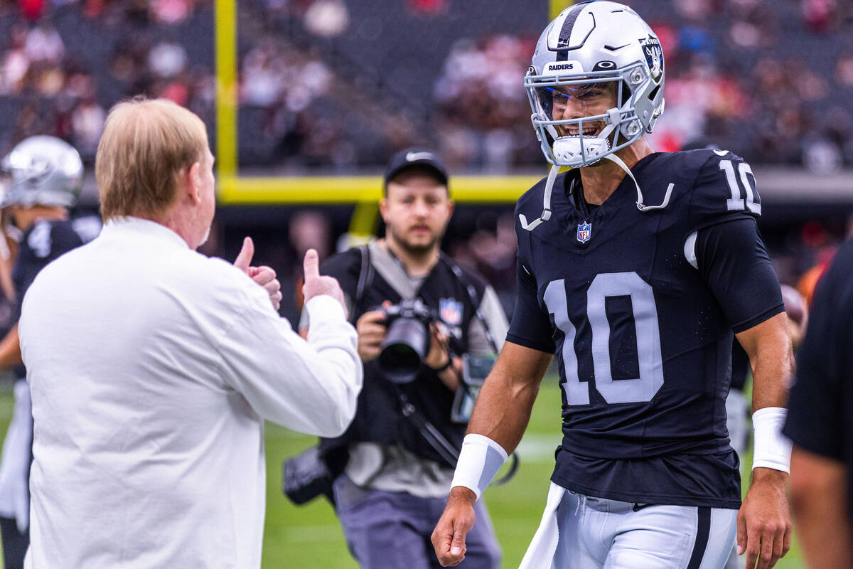 Raiders owner Mark Davis gives the "thumbs up" to quarterback Jimmy Garoppolo (10) du ...